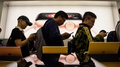 Customers queue at an Apple store to buy the 10th anniversary iPhone X in Hong Kong on November 3, 2017. Anthony Wallace / AFP