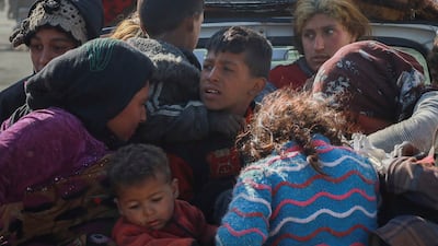 People displaced by violence arrive at a camp in Tabqa city, northern Syria, on Wednesday. AP