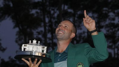 Sergio Garcia of Spain points to the sky as he holds the Masters trophy after winning the 2017 Masters at Augusta National Golf Club in Augusta, Georgia, US, April 9, 2017. Mike Segar / Reuters