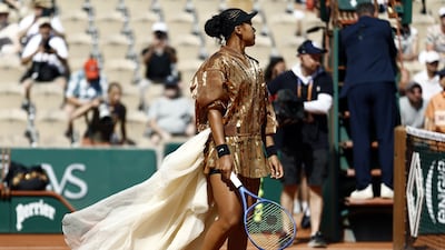 Naomi Osaka arrives on court for her second-round match at the 2026 French Open in a couture-inspired ensemble created by Swiss designer Kevin Germanier. The overall concept was described as "court-ure". EPA