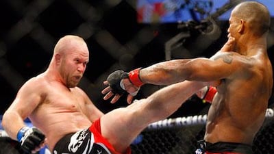 Hector Lombard eats a kick from Tim Boetsch on his UFC debut in Calgary.
