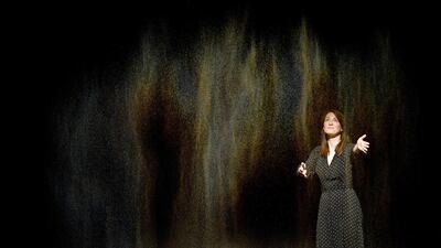 A woman poses with Danish-Icelandic artist Olafur Eliasson's work 'Beauty' (2007) during a press preview at the Tate Modern in London, Britain, 09 July 2019. Photo: EPA