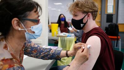Christopher Nicholas, 18, receives his first dose of the Pfizer vaccine on June 6, 2021 in Stanmore, Greater London. Getty Images