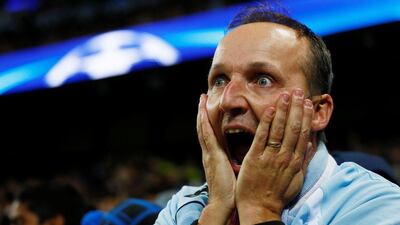 A Manchester City fan reacts to the final scoreline. Jason Cairnduff / Reuters