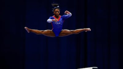 Simone Biles competes on the balance beam at the US Olympic gymnastics trials in St Louis, Missouri, on Friday, June 25. Reuters