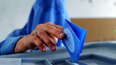 An Afghan woman casts her ballot at a polling station in Herat on June 14, 2014. Aref Karimi / AFP Photo