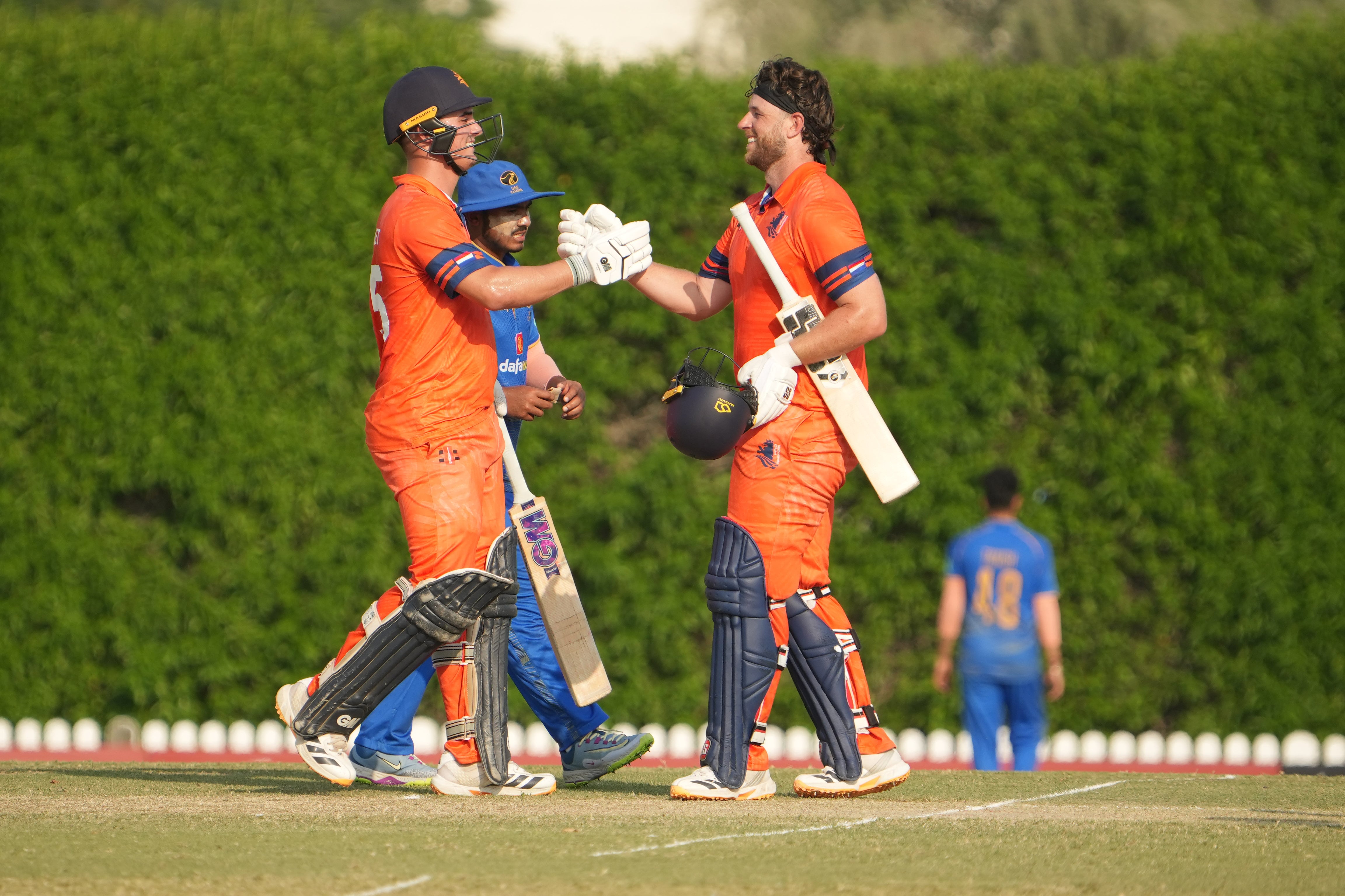 Netherland's Max O'Dowd, right, celebrates his century. Photo: ECB / ICC