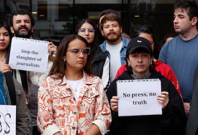 Journalists from various international media outlets stage a sit-in outside the EFE news agency offices in Bogota, Colombia. EPA
