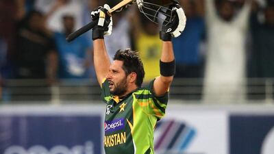 DUBAI, UNITED ARAB EMIRATES - DECEMBER 11: Shahid Afridi of Pakistan celebrate after hitting the winning runs during the first Twenty20 International match between Pakistan and Sri Lanka at Dubai Sports City Cricket Stadium on December 11, 2013 in Dubai, United Arab Emirates. (Photo by Francois Nel/Getty Images)