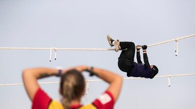 A competitor at the rope climbing challenge on the first day of Dubai Government Games in Kite Beach, Dubai, UAE, on May 9, 2018. Reem Mohammed / The National