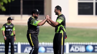 Dubai Pulse bowler Ibthisam Sait cleebrates taking the wicket of Team Abu Dhabi's Ghulam Farid.