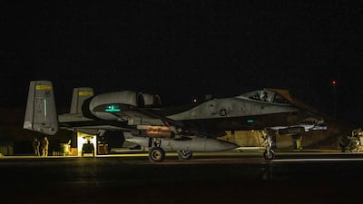 A US Air Force A-10 Warthog ground attack plane taxis for its mission on the night of on December 19, 2025. AFP