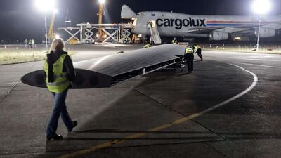 A component of Solar Impulse 2 is loaded to a Boeing 747 cargo plane at Switzerland’s Payerne airport on Monday. Fabrice Coffrini / AFP