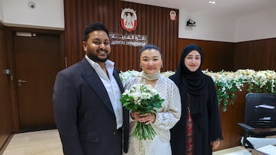 'I don’t think we would have chosen to get married anywhere else. This is now home,' said Ms Doskaliyeva, pictured with Mr Muriyamadon and Asma Abou Shehab