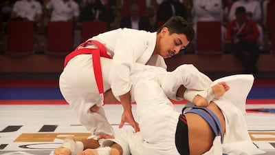 Omar Al Suwaidi from UAE (red) beat compatriot Mayed Al Shehhi in Abu Dhabi. Pawan Singh / The National