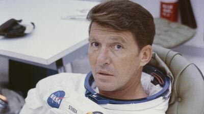 Apollo 7 astronaut Walter Schirra, wearing an Omega Speedmaster, has his spacesuit adjusted before entering the spacecraft for simulated altitude runs at the Kennedy Space Center in 1968. Photo: Space Frontiers / Getty Images