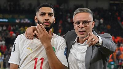 Morocco manager Mohamed Ouahbi alongside Ismael Saibari after their last-32 World Cup win over the Netherlands. AFP