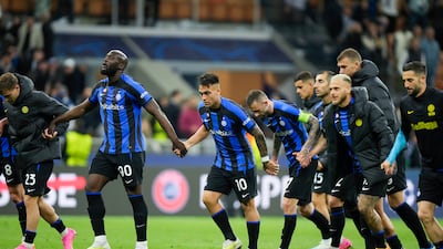 Inter Milan players celebrate in front of their fans after beating Benfica 5-3 on aggregate to reach the Champions League semi-finals. AP