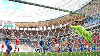 Enner Valencia of Ecuador scores his team's first goal on a header past Diego Benaglio of Switzerland during their match at the 2014 World Cup on Sunday. Clive Brunskill / Getty Images