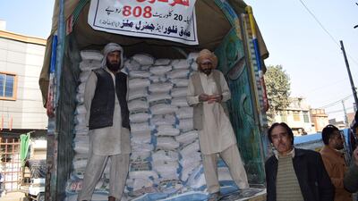 Labourers unload subsidised flour sacks. Agriculture, the most important economic sector of Pakistan, has been neglected in the recent years.