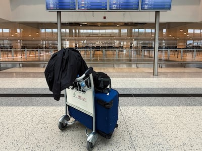 Luggage stands in front of display screens in Beirut-Rafic Hariri International Airport's main hall. Reuters