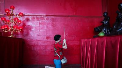 An Indonesian Chinese woman prays at Dharma Sakti temple in Jakarta. Mast Irham / EPA
