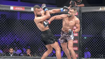 Jalal Al Daaja, right, swings a punch at Tariq Ismail during a bantamweight contest.