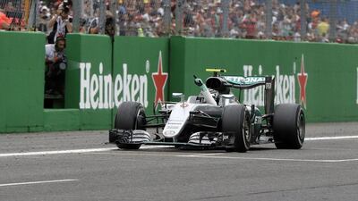 Mercedes driver Nico Rosberg crosses the finish line to win the Formula One Italian Grand Prix. Luca Bruno / AP Photo