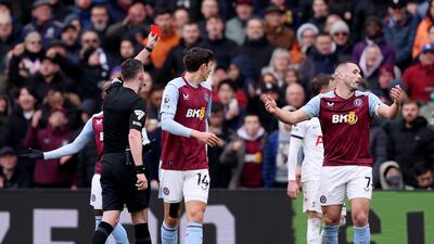 John McGinn of Aston Villa is shown a red card by referee Chris Kavanagh. Getty Images