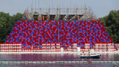 The steel barrels in red, white, blue and mauve were stacked together and, secured by weights, will float in the water. Reuters