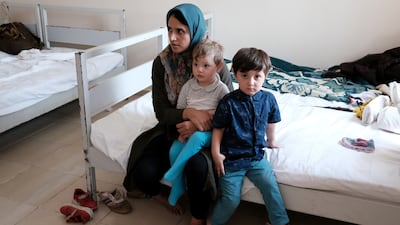 Morsal Mousavi, a 22-year-old Afghan woman, was caught by Turkish security forces after crossing into the country illegally from Iran, and is pictured with her children at a migrant processing centre in the border city of Van. They are just some of thousands of people who have fled Afghanistan since the Taliban takeover. Reuters