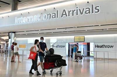 At present, travellers from the UAE must quarantine on arrival in the UK. AFP