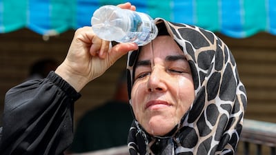A pilgrim cools off in Makkah during the 2024 heatwave. AFP