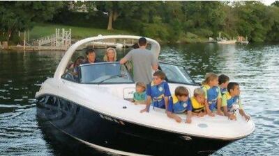 Republican presidential candidate Mitt Romney, rear left, and his wife Ann, with their grandchildren in the bow of their boat, depart from the public docks on Lake Winnipesaukee in Wolfeboro, N.H., Monday, July 2, 2012, as they continue their vacation from the campaign trail. (AP Photo/Charles Dharapak)