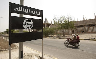 An Al Qaeda logo on a street sign in the town of Jaar in Yemen’s southern Abyan province in 2012. AP