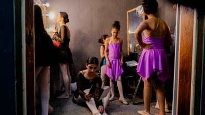 Students of the Ballet Academy prepare to perform during the school annual ceremony in Baghdad, Iraq, Friday, April 1, 2022. (AP Photo / Hadi Mizban)