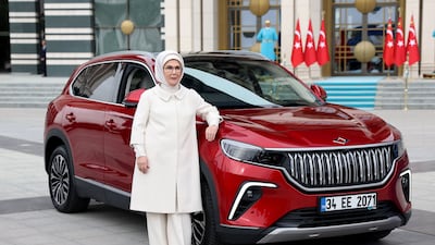 Ms Erdogan poses with her new car