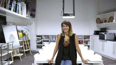 Luma Al Mukhalalati, co-founder of Art Central at Boutik Mall , was drawn to painting as she grew up watching her father, Talal, an artist, produce beautiful work in his spare time. Christopher Pike / The National