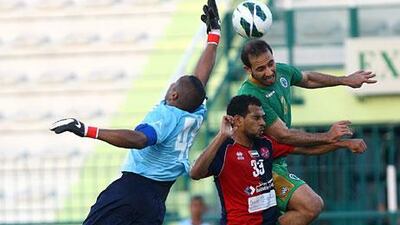 Mutaz Abdullah, left, and Eissa Ahmad, centre, and their Al Shaab teammates played an Al Shabab side that rested most of its regulars but who still put a fight in a 2-1 win that kept Al Shaab from relegation.