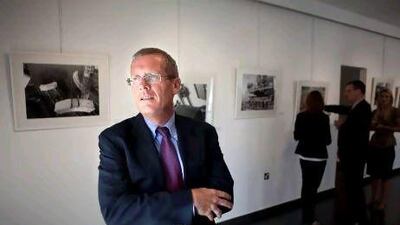 Roy Lengweiler at his photo exhibition, Sheikh Zayed Bridge - The Human Angle, at the Ghaf Art Gallery in Abu Dhabi. Silvia Razgova / The National