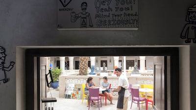 Vinayak Commar serves coffee at a cafe inside the Mawaheb studio before it shut down last year. Christopher Pike / The National