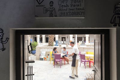 Vinayak Commar serves coffee at the cafe in the Mawaheb studio in the Al Fahidi district of Bur Dubai before it shut down last year. Christopher Pike / The National