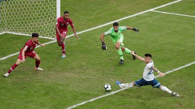 Argentina's Lautaro Martinez in action with Qatar's Saad Alsheeb, Salem Al Hajri and Bassam Alrawi. Reuters