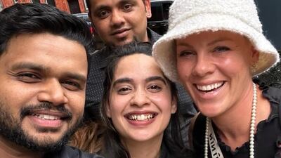 Pop star Pink with staff at Asha's Birmingham. Photo: @ashasbhamuk / Instagram