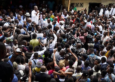 Defeated opposition candidate Martin Fayulu, who has vowed to contest the result, speaks to a large crowd of his supporters in Kinshasa. Hugh Kinsella Cunningham / EPA