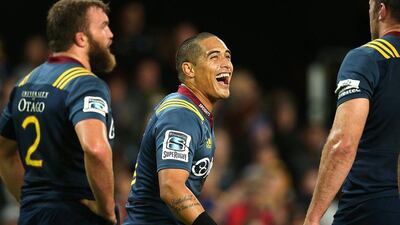 Aaron Smith of the Highlanders smiles with teammates during their Super Rugby win over Golden Lions on Saturday. Martin Hunter / AFP / March 12, 2016