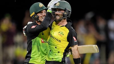 Glenn Maxwell, right, with Alex Carey after hitting the match-winning runs against England. Tracey Nearmy / PA