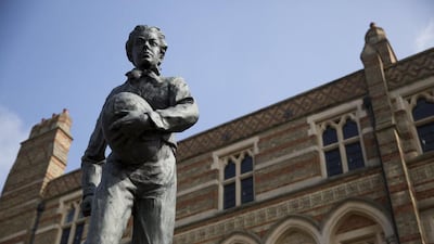 A statue of William Webb Ellis, who is widely credited with inventing the game of rugby, stands outside Rugby School in Rugby, England. Neil Hall / Reuters