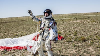 Mr Baumgartner celebrates after successfully completing the final manned flight for Red Bull Stratos in Roswell in 2012. Reuters