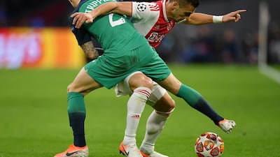 Dusan Tadic of Ajax is challenged by Tottenham's Kieran Trippier. Getty